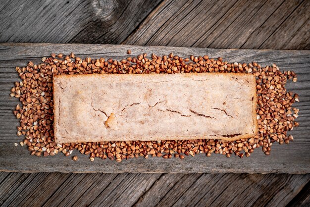 Buckwheat bread. Freshly baked traditional bread on wooden table.