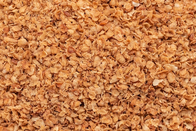 Buckwheat cereal in a white saucer on a gray concrete background