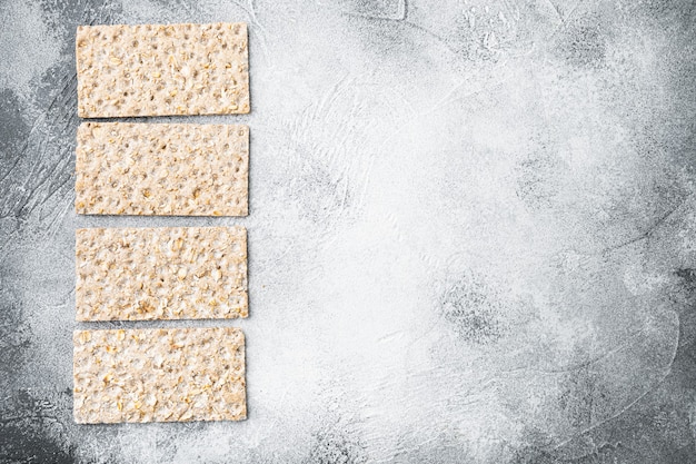 Buckwheat crisp bread set, on gray stone table, top view flat lay