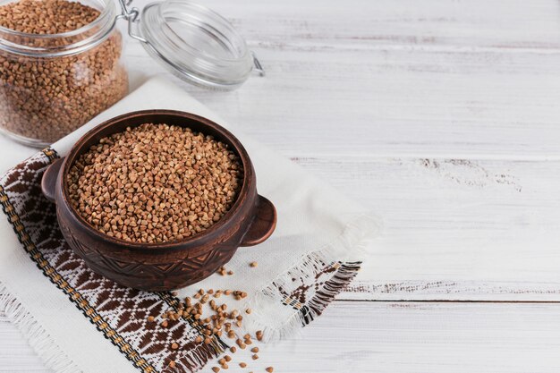 Buckwheat groats close up. Grains of raw buckwheat as a texture.