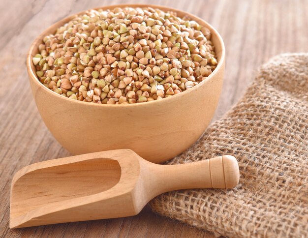 Buckwheat isolated in a wooden bowl