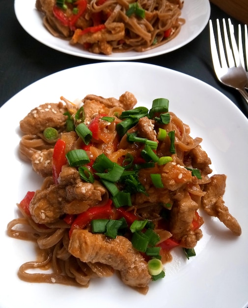 Buckwheat noodles with chicken on a plate