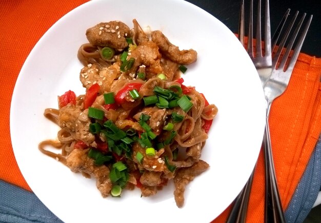 Buckwheat noodles with chicken on a plate