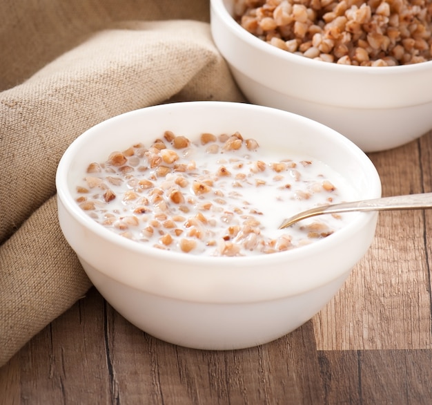 Buckwheat porridge in a bowl on a wooden table