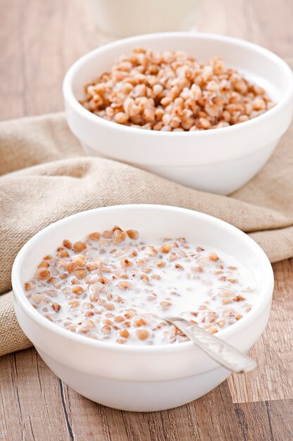 Buckwheat porridge in a bowl on a wooden table