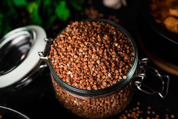 Buckwheat porridge on a dark background. Buckwheat with stewed chicken. High quality photo