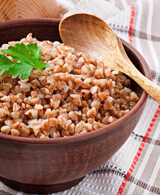 Buckwheat porridge in an old ceramic bowl on a rustic style