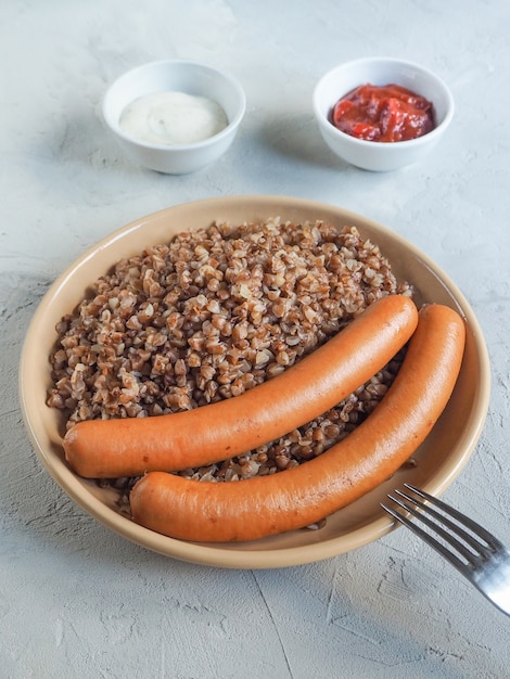 Buckwheat porridge and sausages. Simple Russian country cuisine.
