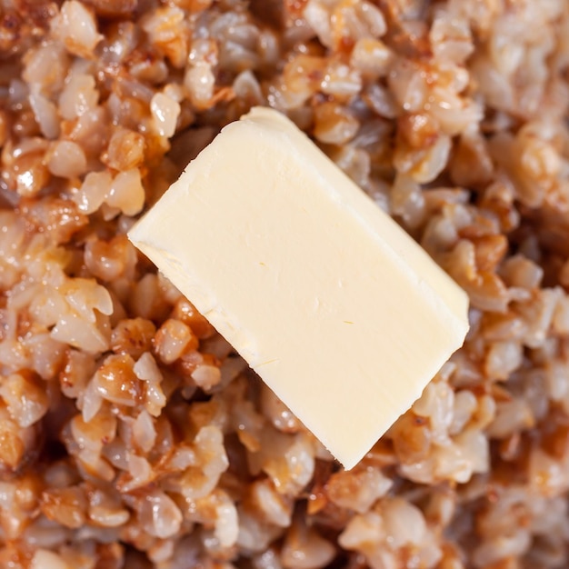 Buckwheat porridge with butter in white plate Diet food