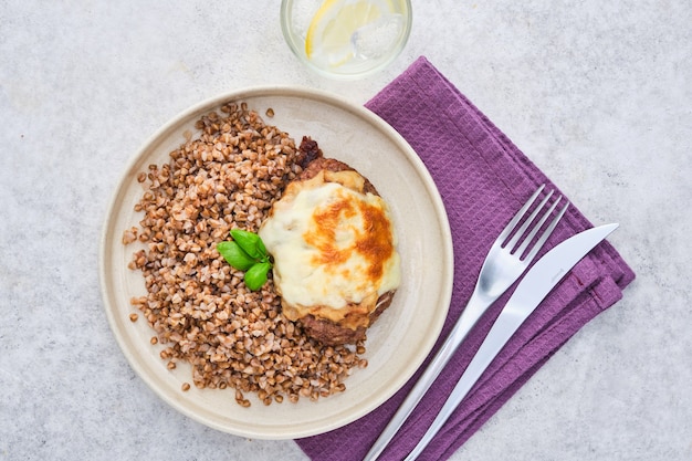 Buckwheat porridge with cutlet, top view.