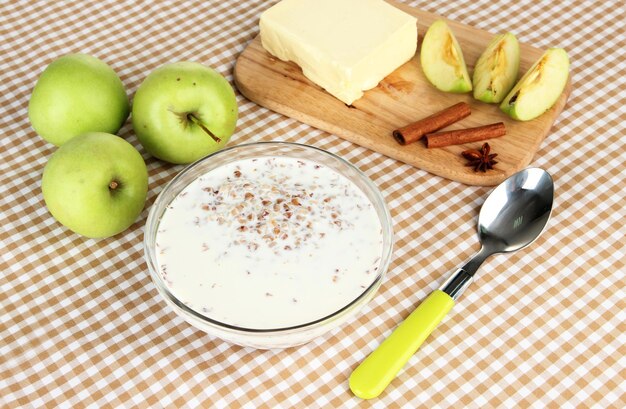 Buckwheat porridge with milk on table closeup