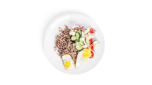 Buckwheat porridge with quail eggs and vegetable salad.