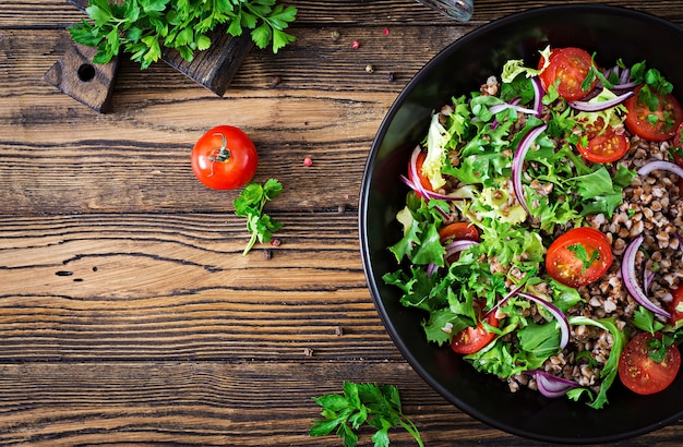 Premium Photo | Buckwheat salad with cherry tomatoes, red onion and ...