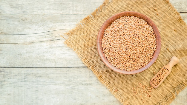 Buckwheat in teralke on the table. Selective focus.