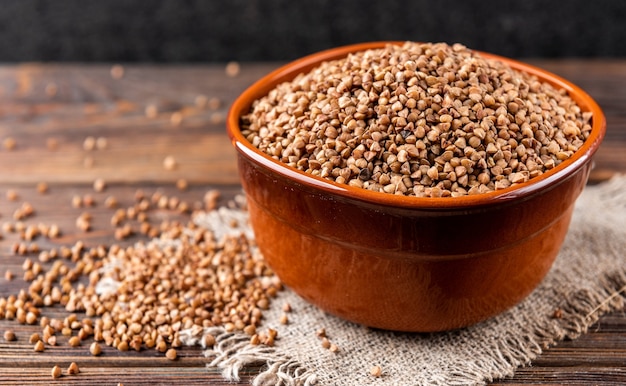 Buckwheat on a wooden bowl