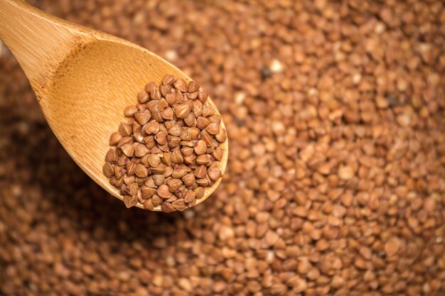 Buckwheat in a wooden spoon