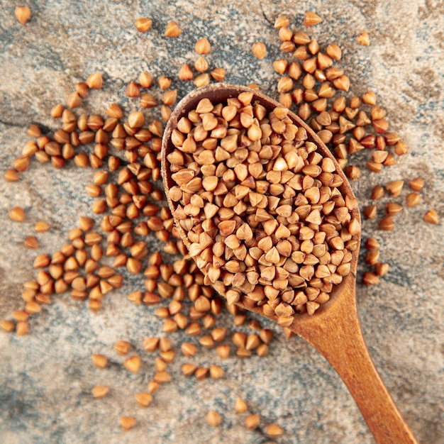 Buckwheat in wooden spoon