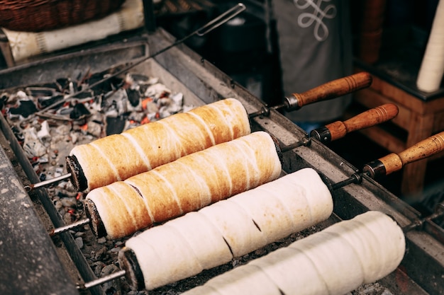 Budapest hungarian sweets kurtoskalacs chimney pastry spit cake on christmas market traditional