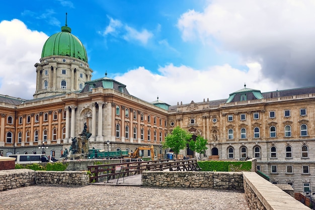 BUDAPEST, HUNGARY-MAY 03, 2016 :Budapest Royal Castle -Courtyard of the Royal Palace in Budapest with construction equipment in the backyard with people.