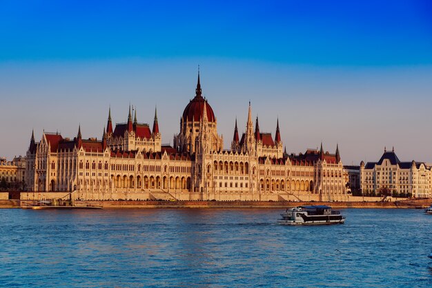 Budapest Parliament building and Danube river at sunset, travel Hungary background