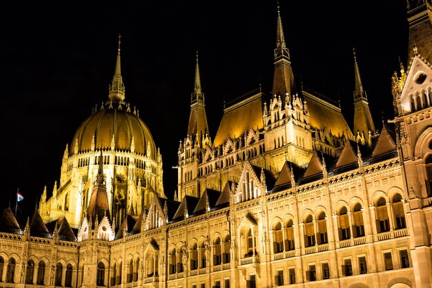 Budapest parliament building at night with dark sky