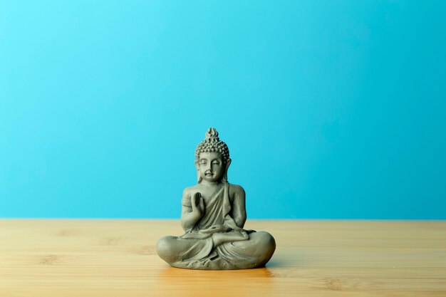 Buddha figurine on table