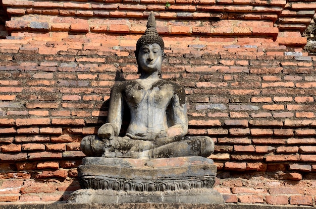 Buddha statue damage and broken with Ancient building at Historic Town of Sukhothai and Associated Historic Towns in Sukhothai Thailand