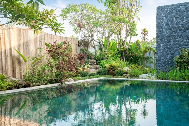 Buddha statue in the garden of swimming pool