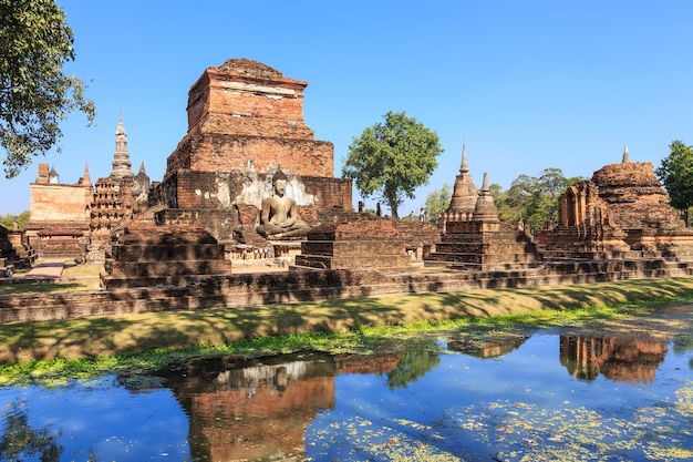 Buddha statue and pagoda in Wat Maha That Shukhothai Historical Park Thailand