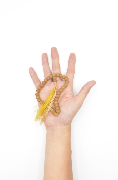 Buddhist prayer beads on hand Master of Chinese martial arts Isolated on white