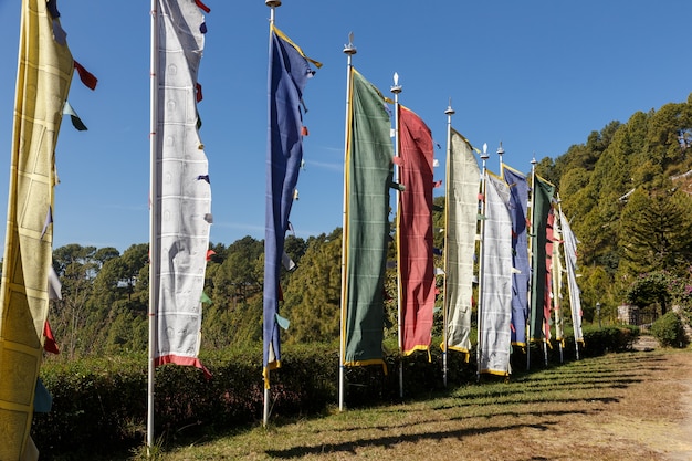 Buddhist prayer flags. multi-colored flags on poles fluttering in the wind in the mountains.