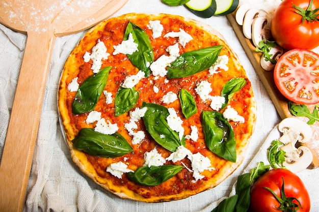 Bufala Mozzarella Pizza. Neapolitan pizza made with tomato sauce, mozzarella cheese and vegetables. 