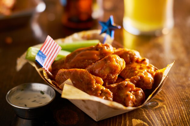 Buffalo chicken wings with a patriotic theme and American flag