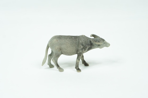 Buffalo mini figure isolated on white background. Plastic animal toys.