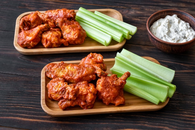 Buffalo wings with fresh celery stalks