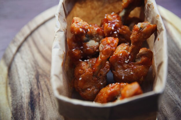 Buffalo wings on wood background