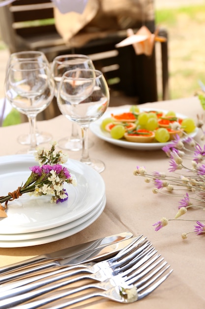 Buffet table with dishware waiting for guests