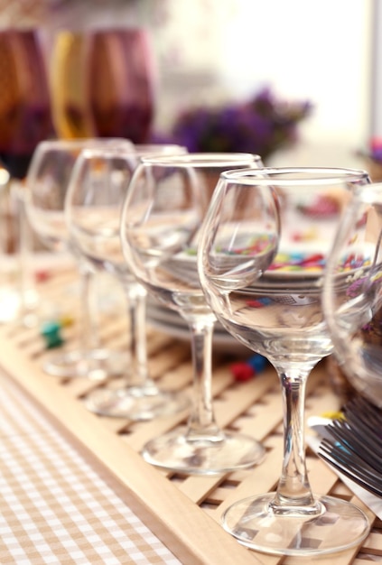 Buffet table with dishware waiting for guests