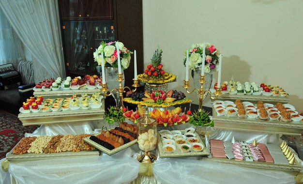 A buffet table with a variety of food on it