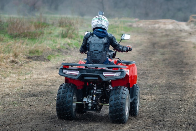 Buggy moves on a dusty road in autumn