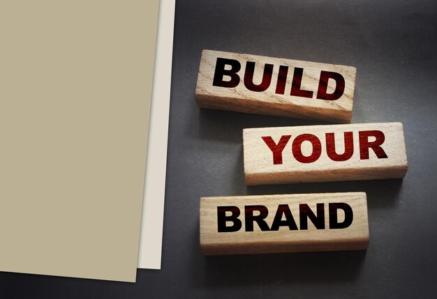 Photo build yor brand words on wooden blocks marketing concept