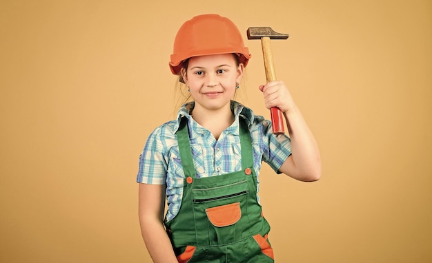 Build your future yourself Initiative child girl hard hat helmet builder worker Tools to improve yourself Child care development Builder engineer architect Future profession Kid builder girl