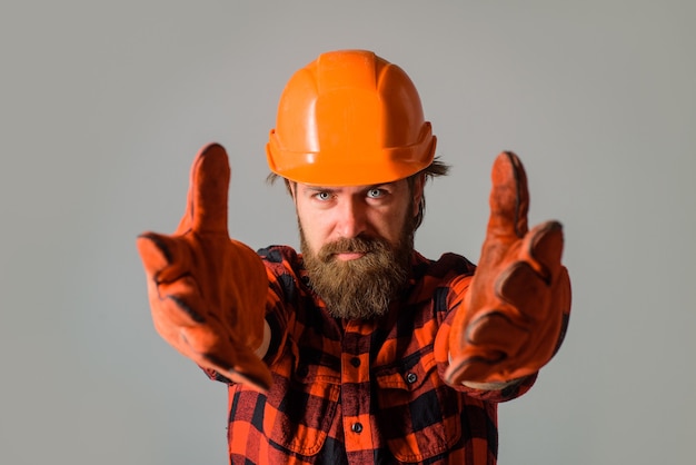 Builder work building industry technology builder in hard hat workman in hardhat and work gloves