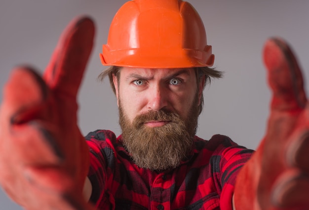 Builder work building industry technology workman in hardhat and work gloves advertise repairment