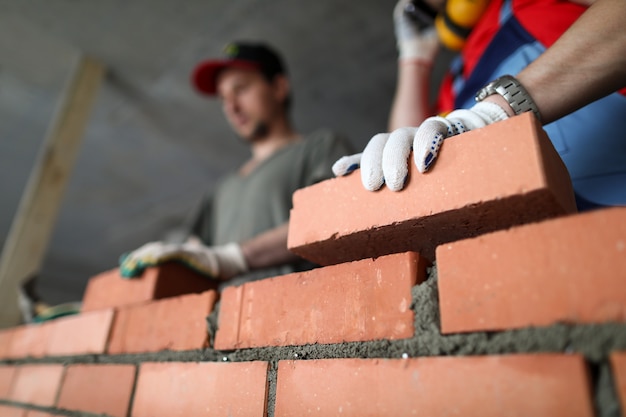 Builders make wall brick and cement technology