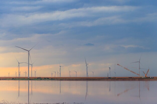 Building and assembling a construction wind turbines farm by a crane