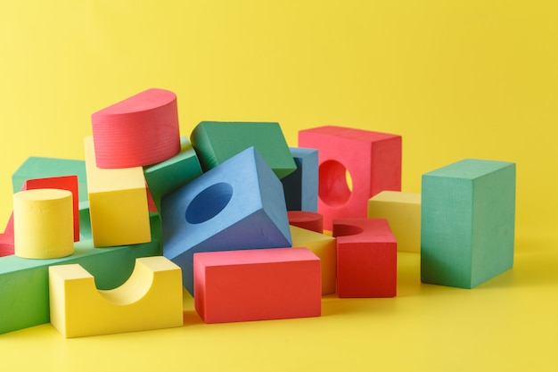 Photo building blocks on yellow surface