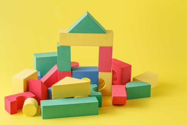 Building blocks on yellow surface