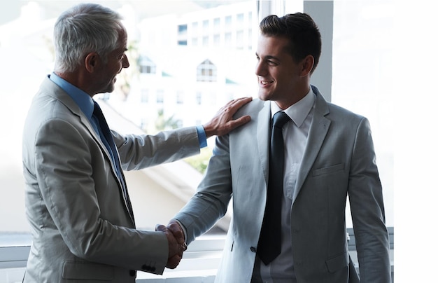 Building business relationships Two businessmen shaking hands