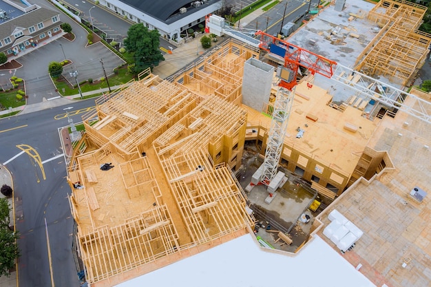 Building under construction site during the construction of tower cranes of heights